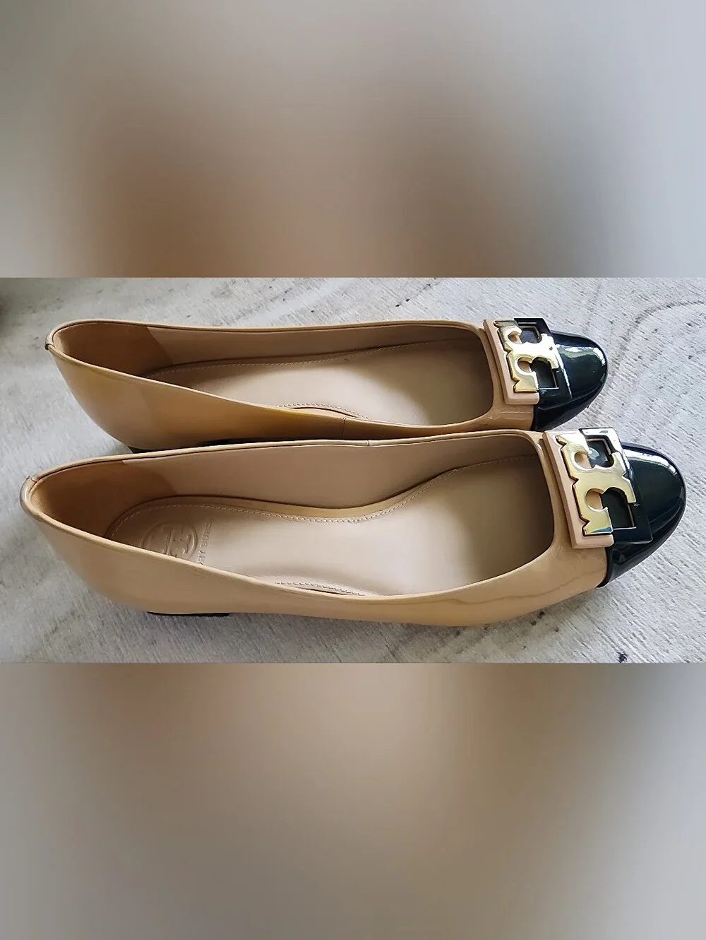Two-Tone Beige and Black Cap-Toe Ballet Flats with Gold Accent